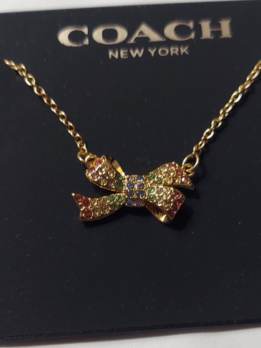 Coach Gold-tone Multicolor Crystal Bow Pendant Necklace
